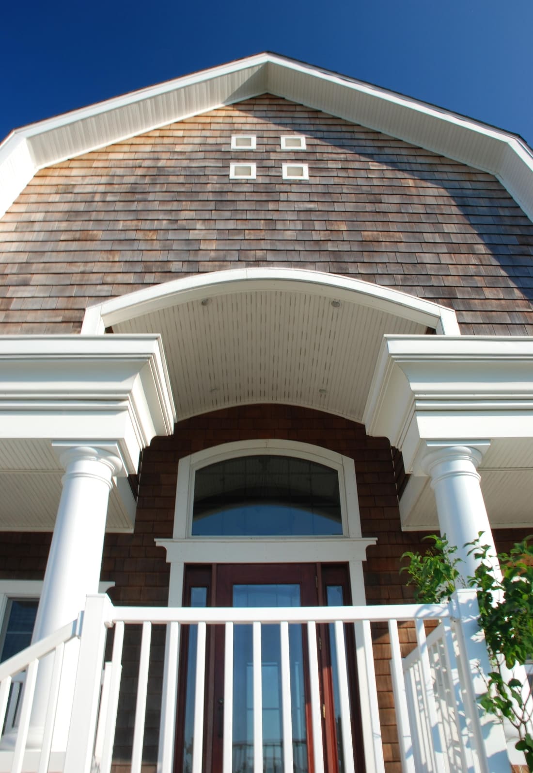 Covered entrance with white columns