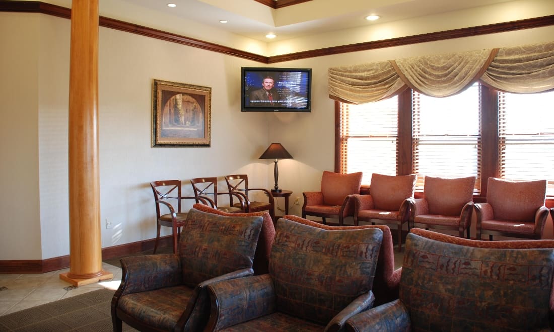 Comfortable waiting room with armchairs and natural light